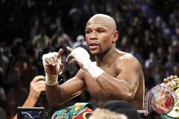 Mayweather Juarai 'Pertarungan Terbesar Abad Ini' 